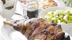 Roast lamb studded with rosemary & garlic