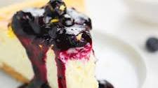 Vanilla Bean Cheesecake with Blueberry Lemon Sauce